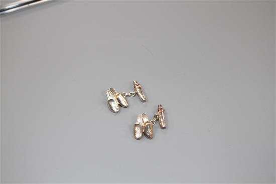 A pair of modern Asprey & Co silver and red enamel cufflinks, modelled as a pair of slippers, engraved with the letter A